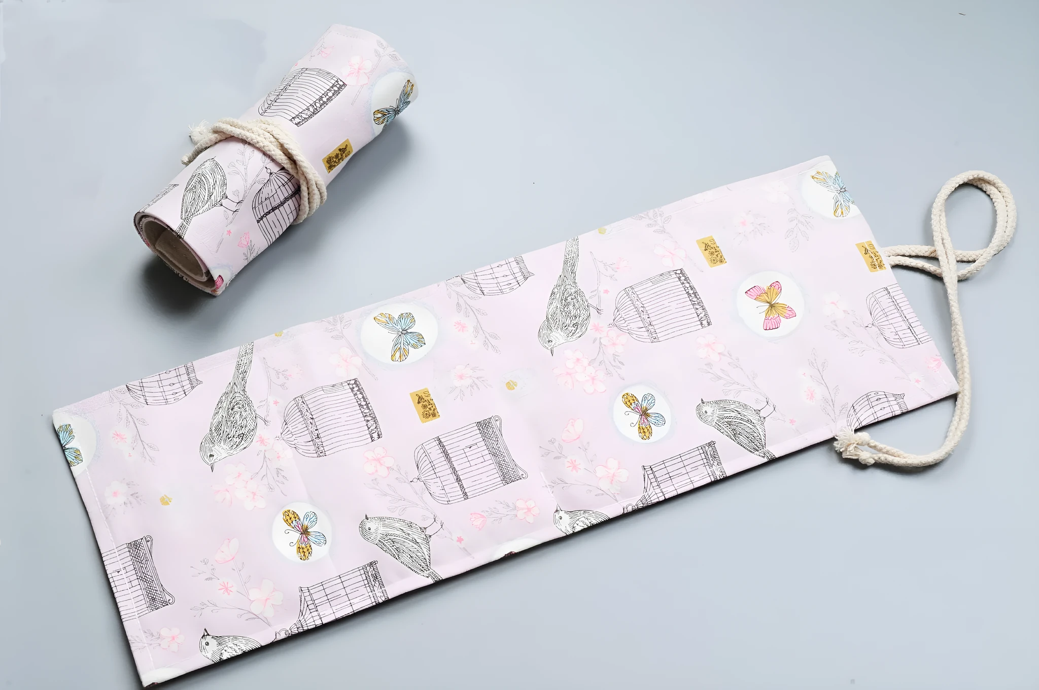 Canvas pencil wrap roll up case with elastic bands holding coloured pencils, available in multiple slot sizes