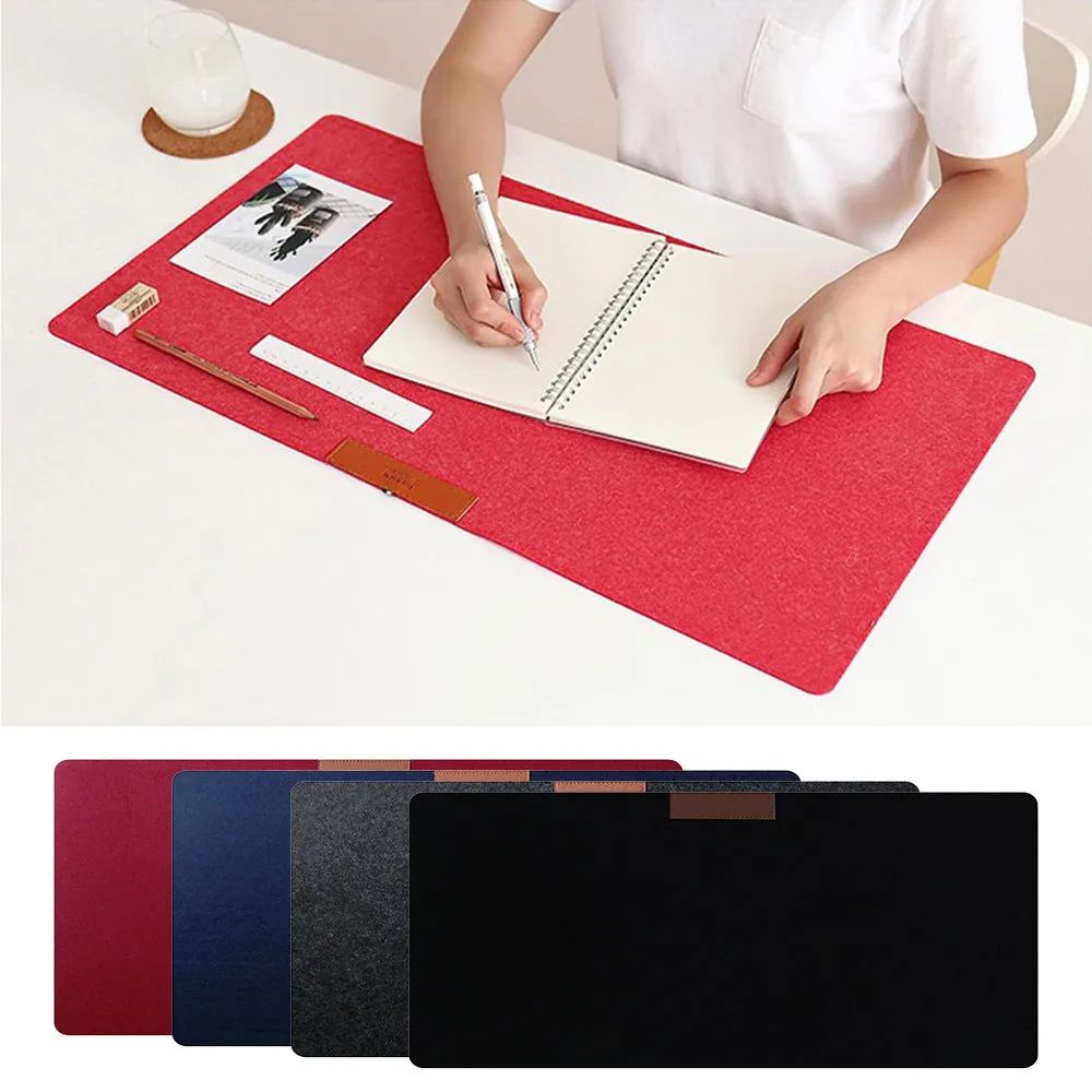 Large felt mouse pad in black on office desk with keyboard and mouse, 325x635mm