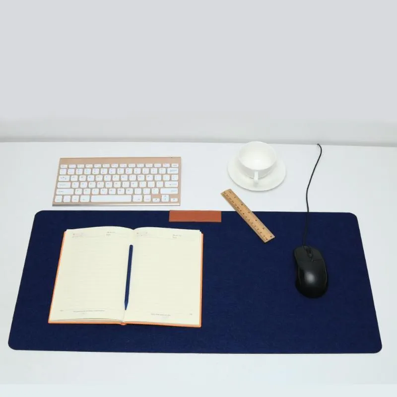 Large felt mouse pad in black on office desk with keyboard and mouse, 325x635mm