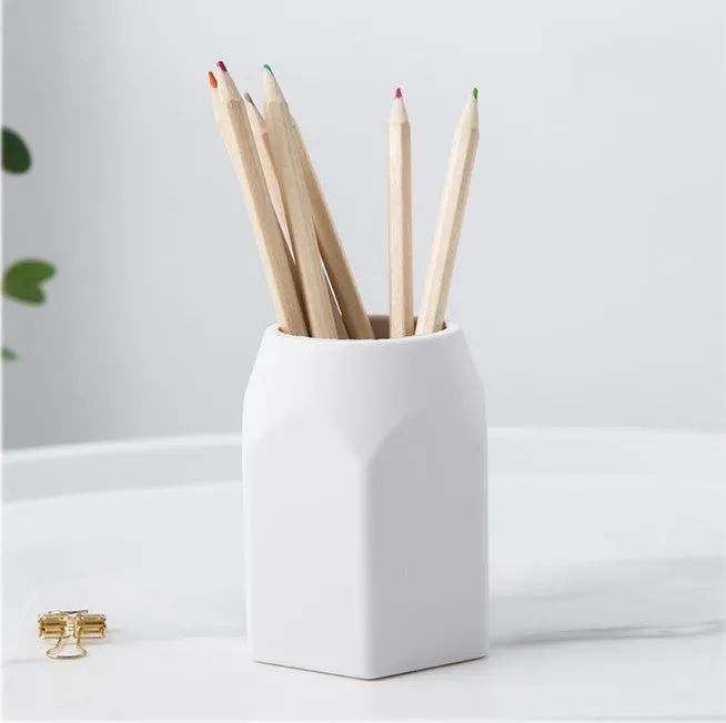 Round solid silicone pen holder in white, 80x95mm, on a clean desk with pens