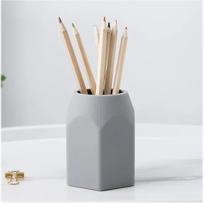 Round solid silicone pen holder in white, 80x95mm, on a clean desk with pens