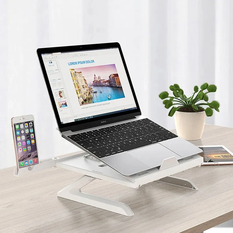 Black folding aluminium laptop stand with 9-level angle adjustment and cooling slot, on a desk with a laptop