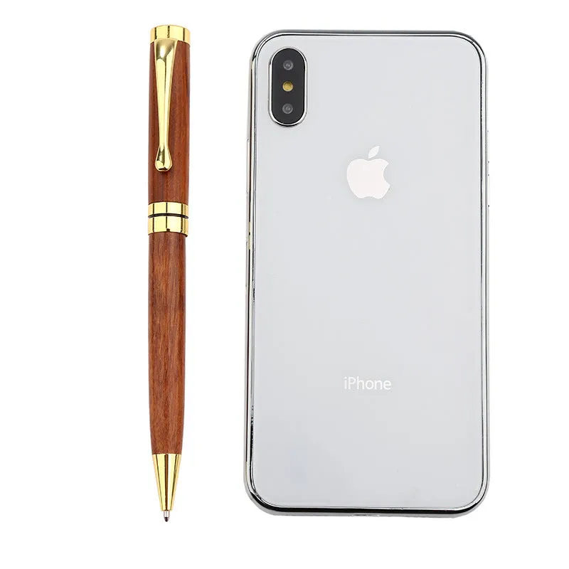 Gold metal and rosewood ballpoint pen 14cm long with cap