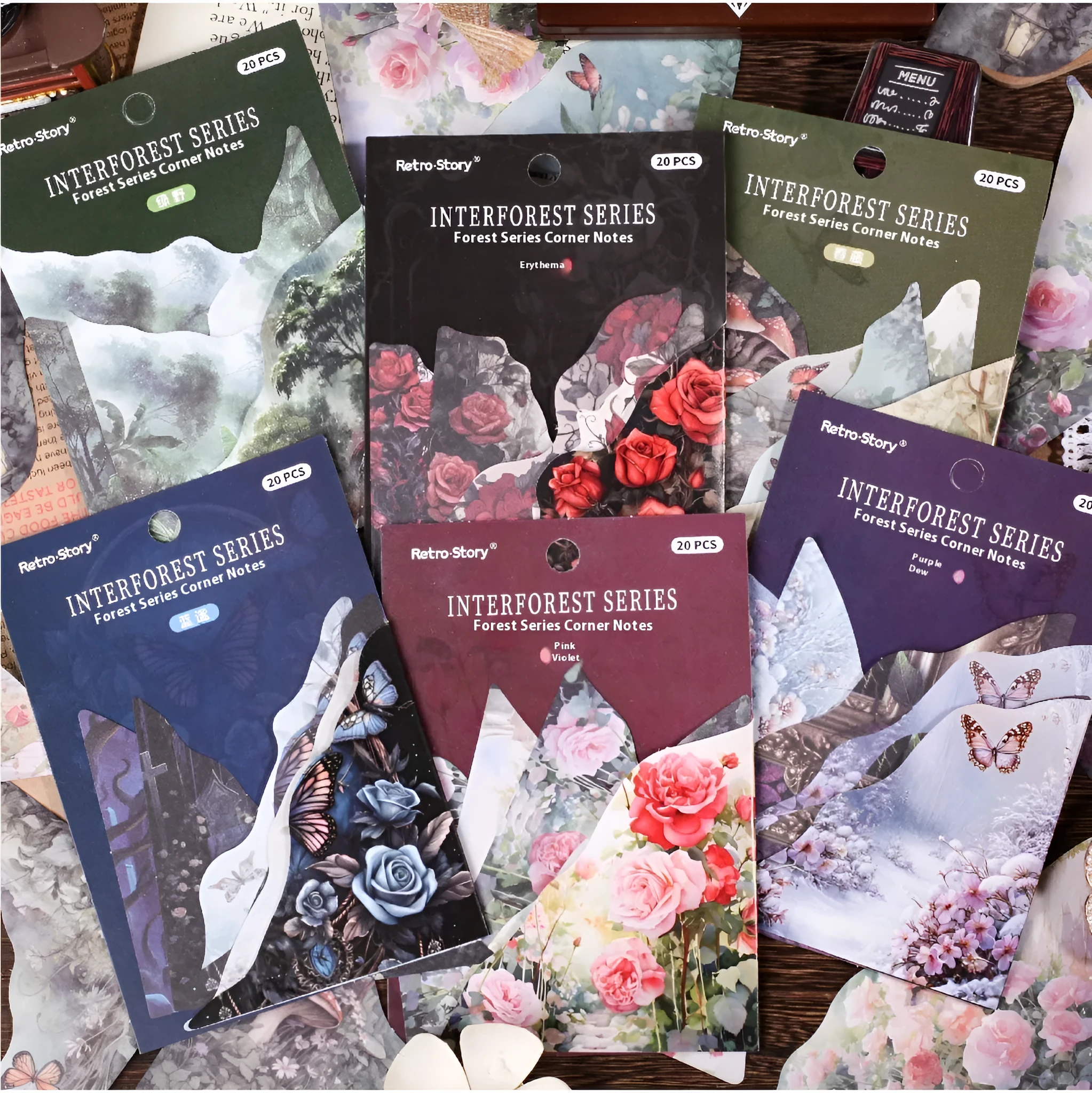 Set of printed paper bookmarks and notes in six different colours including blue, green, pink, purple, and red designs