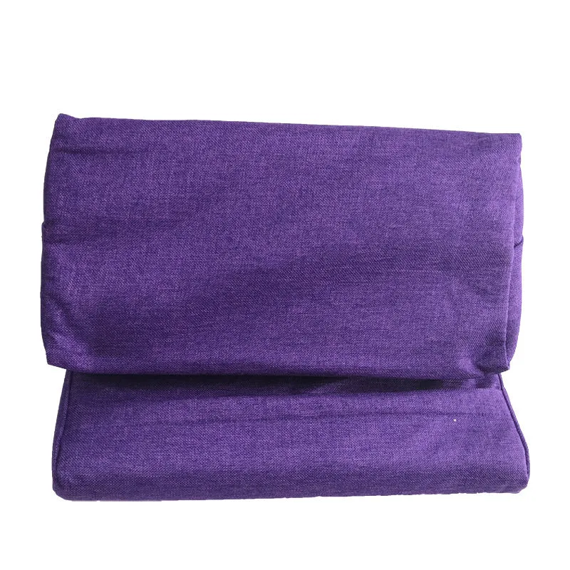 Candy-shaped tablet and phone support pillow with slow rebound fill, beige colour, on a bed