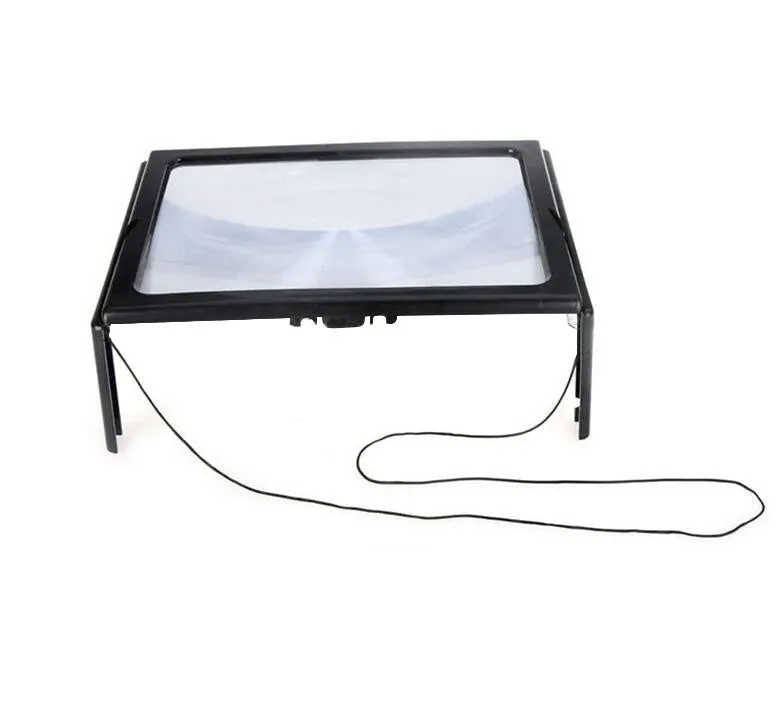Desktop magnifying glass with 4 LED lights on black ABS frame over an A4 page