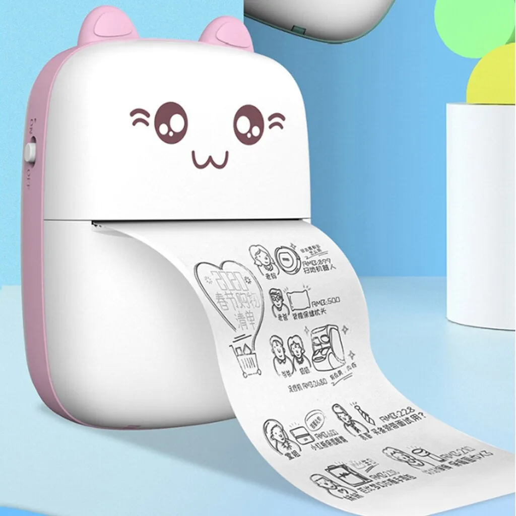 Pink mini Bluetooth thermal printer on a desk with a phone and printed note, measuring 11x8x3.5cm