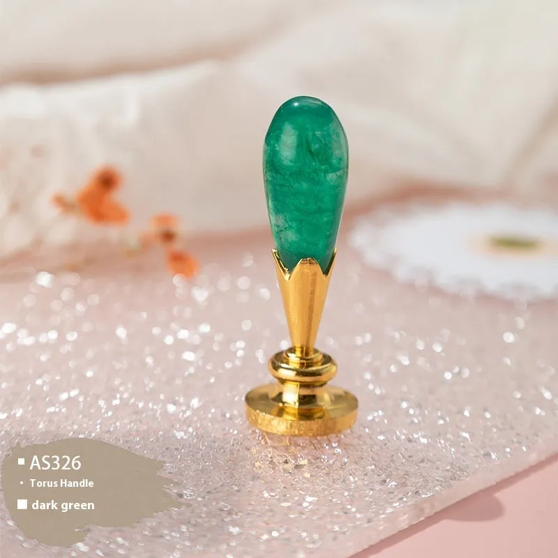 Wooden wax seal handle tool showing various style options like lily, owl platform, and Roman column designs.
