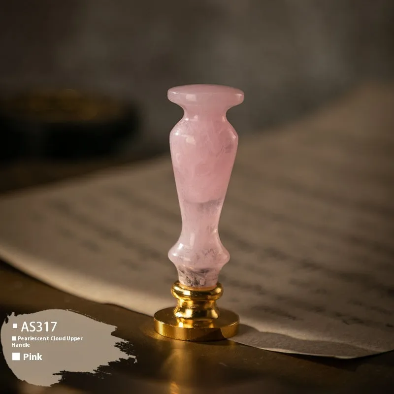 Wooden wax seal handle tool showing various style options like lily, owl platform, and Roman column designs.