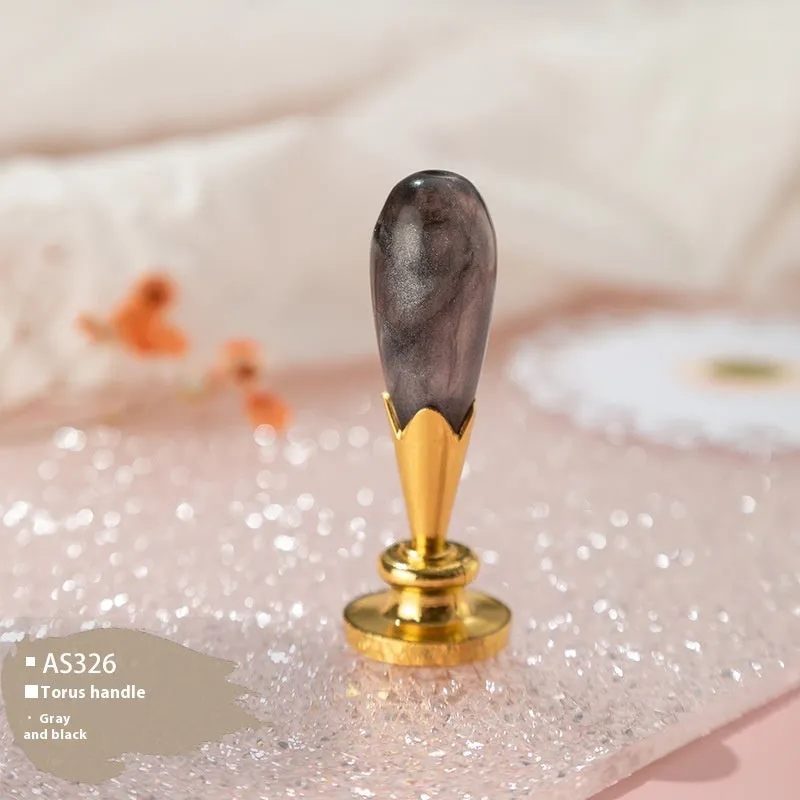 Wooden wax seal handle tool showing various style options like lily, owl platform, and Roman column designs.