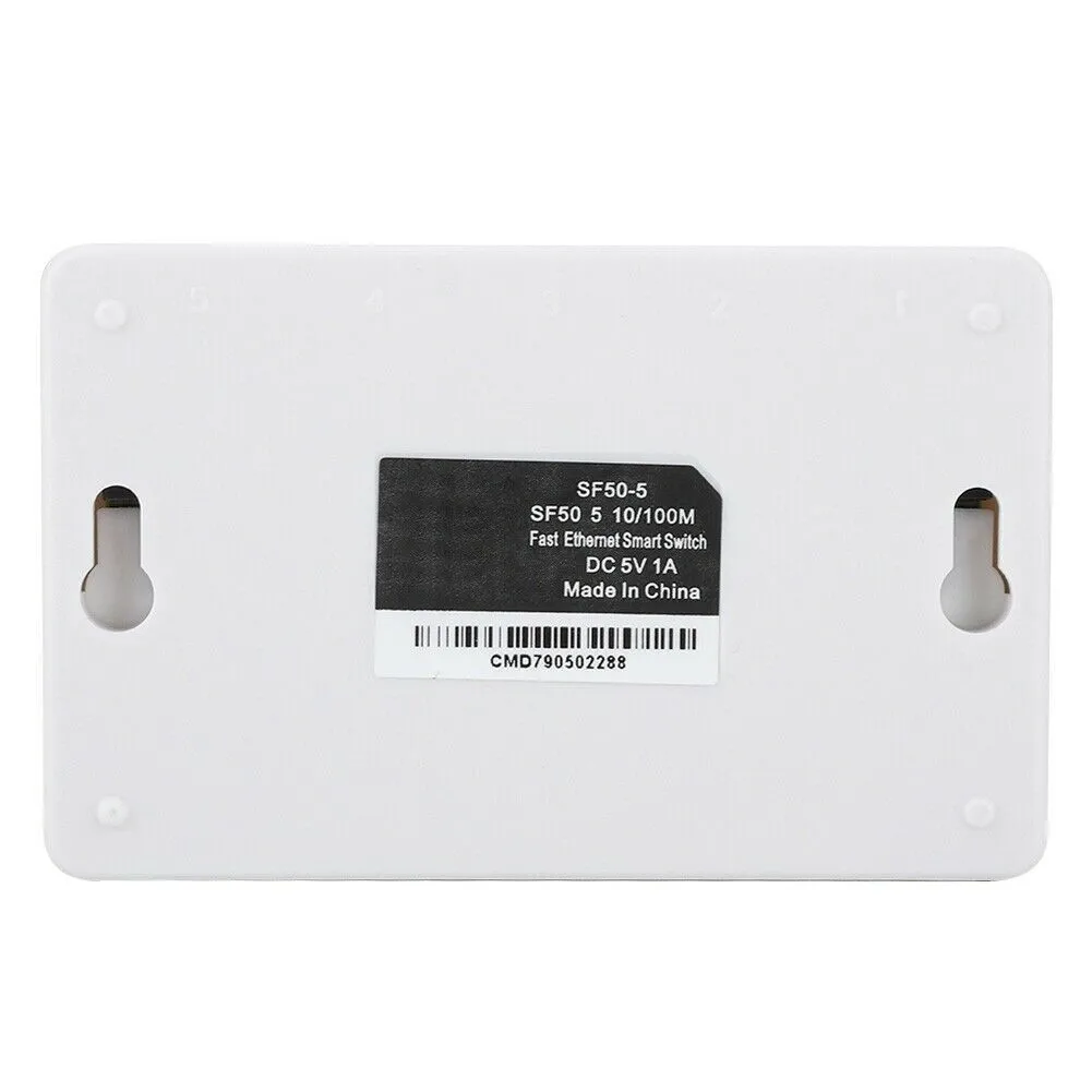 White 5-port 100 Mbps Ethernet switch with LED indicators on a desk