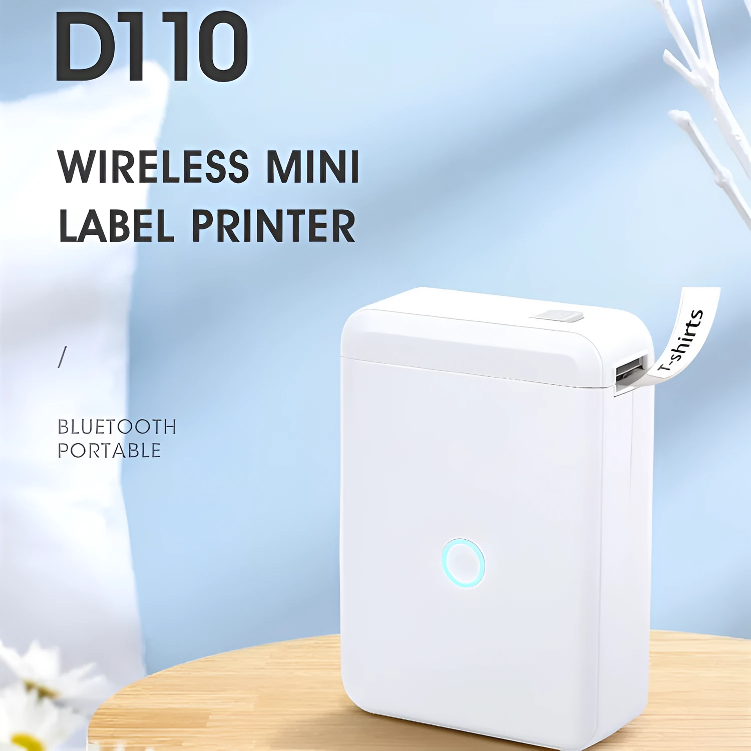 D110 thermal label printer in white with half-inch label roll, front view showing compact size and paper slot