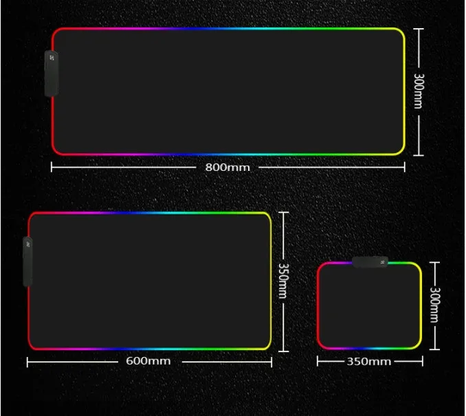 RGB luminous mouse pad with multi-colour LED lighting, fabric surface, and rubber base, shown on a desk with a mouse and keyboard