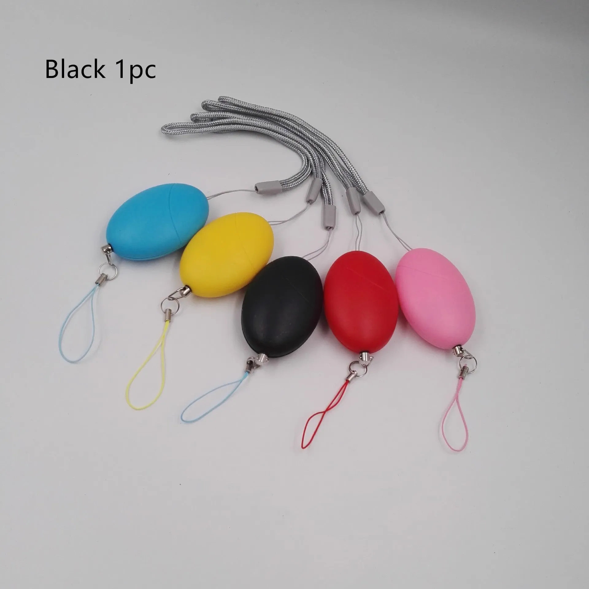 Oval personal safety alarm in black with keychain ring, loud 120dB sound