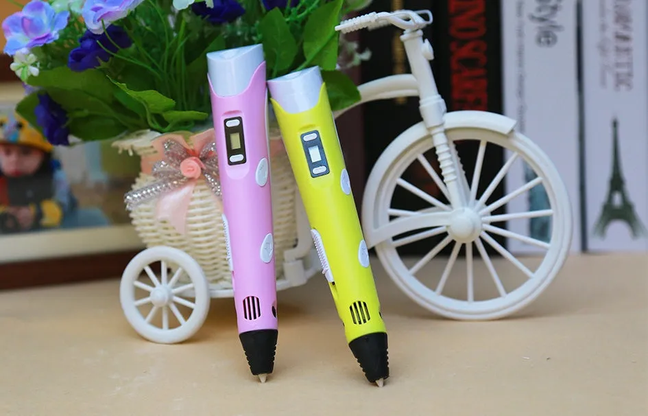 Yellow 3D printing pen with PLA filament spool on a white surface, showing nozzle and controls
