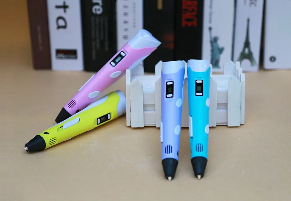 Yellow 3D printing pen with PLA filament spool on a white surface, showing nozzle and controls