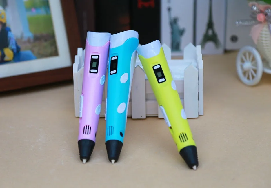 Yellow 3D printing pen with PLA filament spool on a white surface, showing nozzle and controls