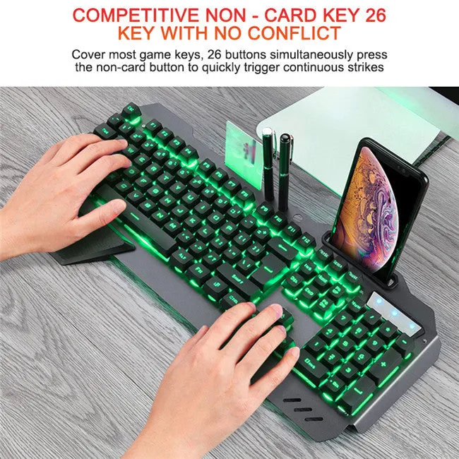 Black wired gaming keyboard with RGB backlight, floating keycaps, phone holder slot, pen slot, and card slot on a desk