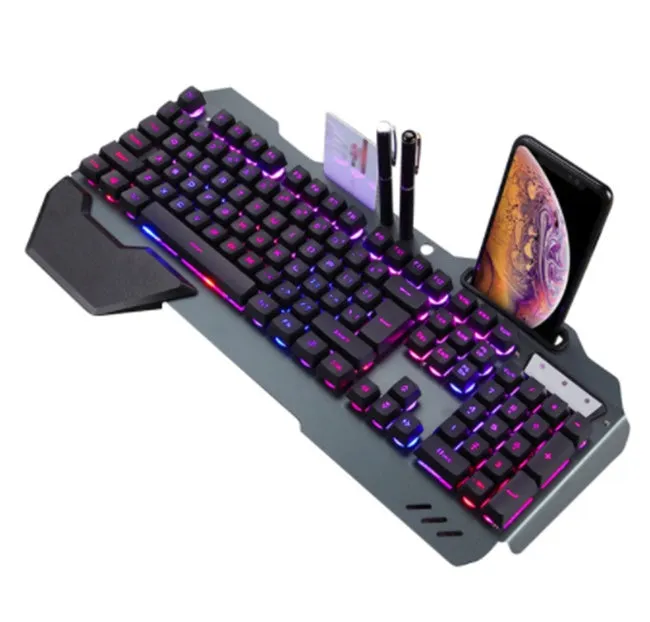 Black wired gaming keyboard with RGB backlight, floating keycaps, phone holder slot, pen slot, and card slot on a desk
