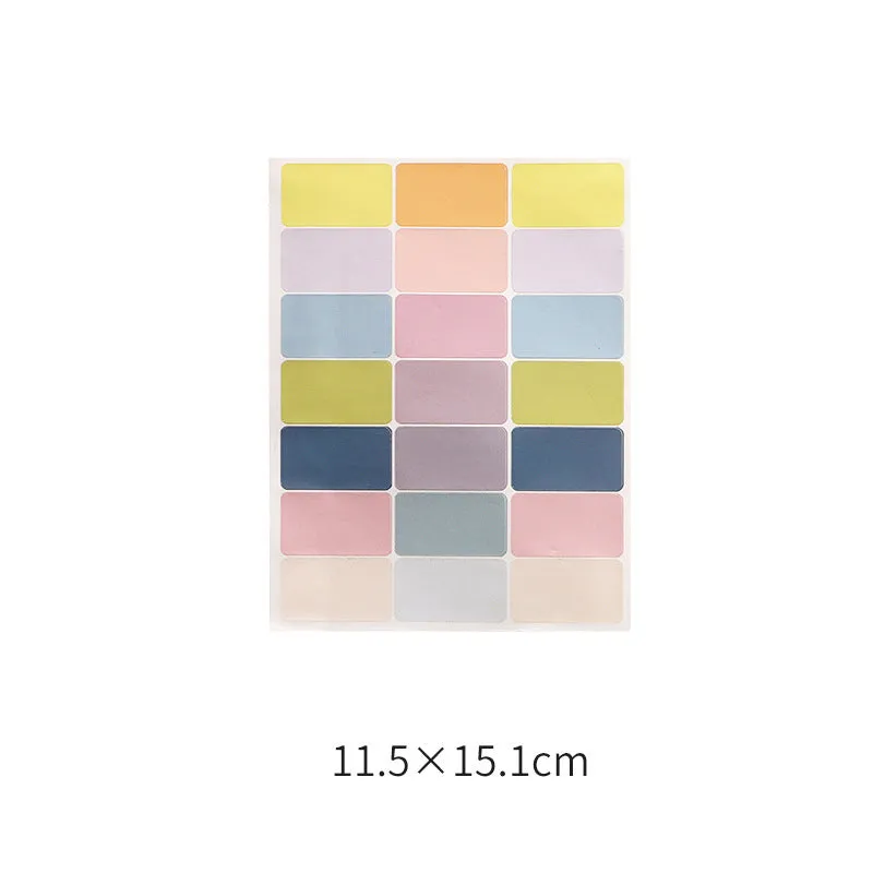 Assortment of handwritten labels, grid stickers, A6 rulers, and coloured sticky notes on a white background.