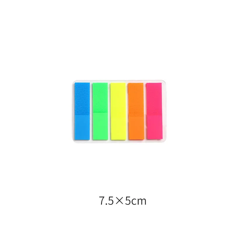 Assortment of handwritten labels, grid stickers, A6 rulers, and coloured sticky notes on a white background.