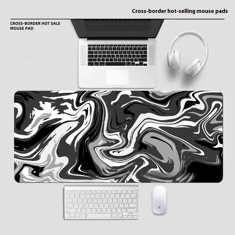 Large diatom ooze mouse pad with printed pattern, non-slip rubber sole, and polyester surface for desk use
