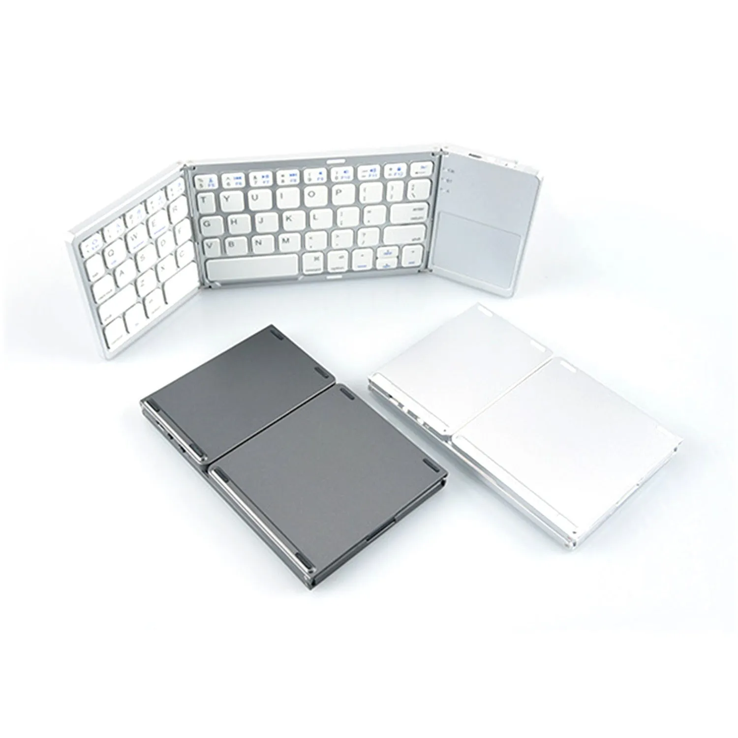 Black tri-fold Bluetooth keyboard shown unfolded next to folded silver version