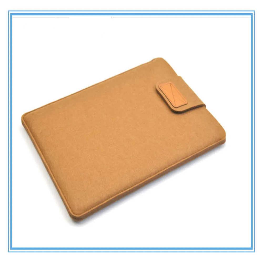 Dark grey plush felt vertical clutch laptop bag showing clamshell opening and structured interior.
