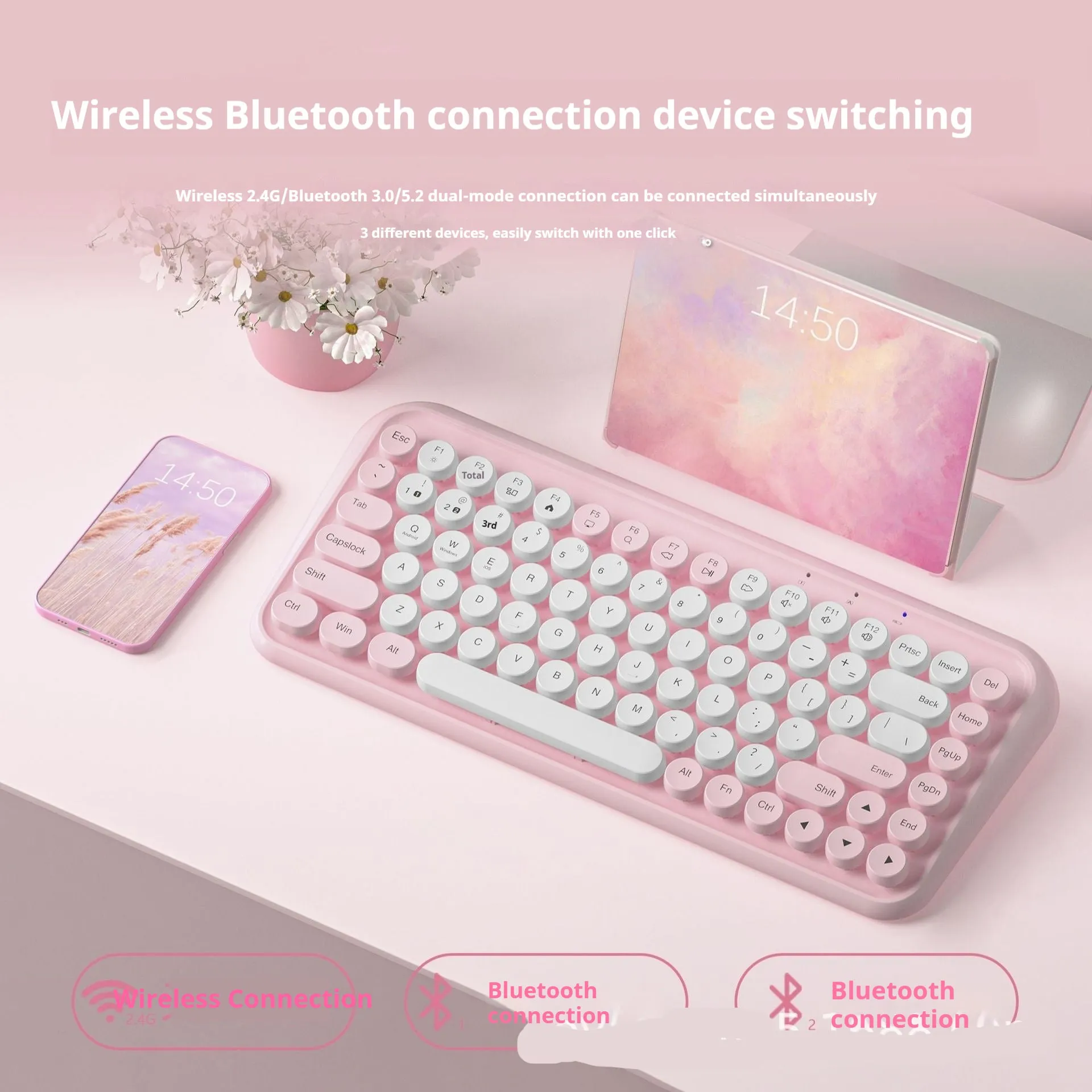 Pink portable Bluetooth keyboard with 84 keys on a desk.