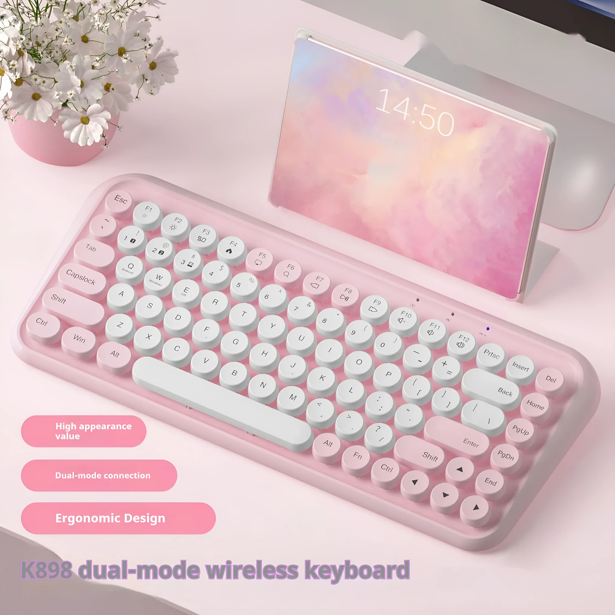 Pink portable Bluetooth keyboard with 84 keys on a desk.