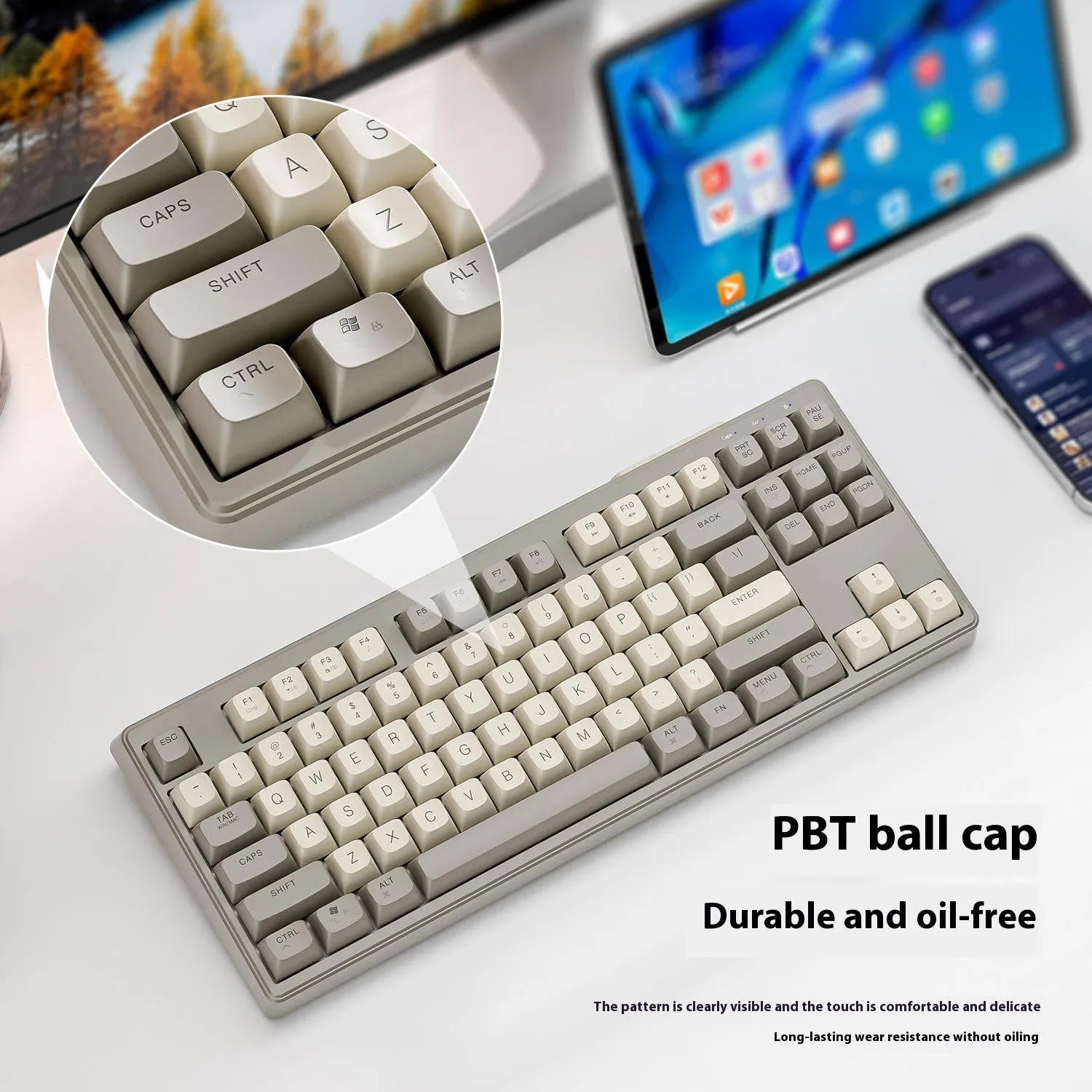 Compact wireless Bluetooth keyboard in blueberry colour with USB receiver and cable on a desk.