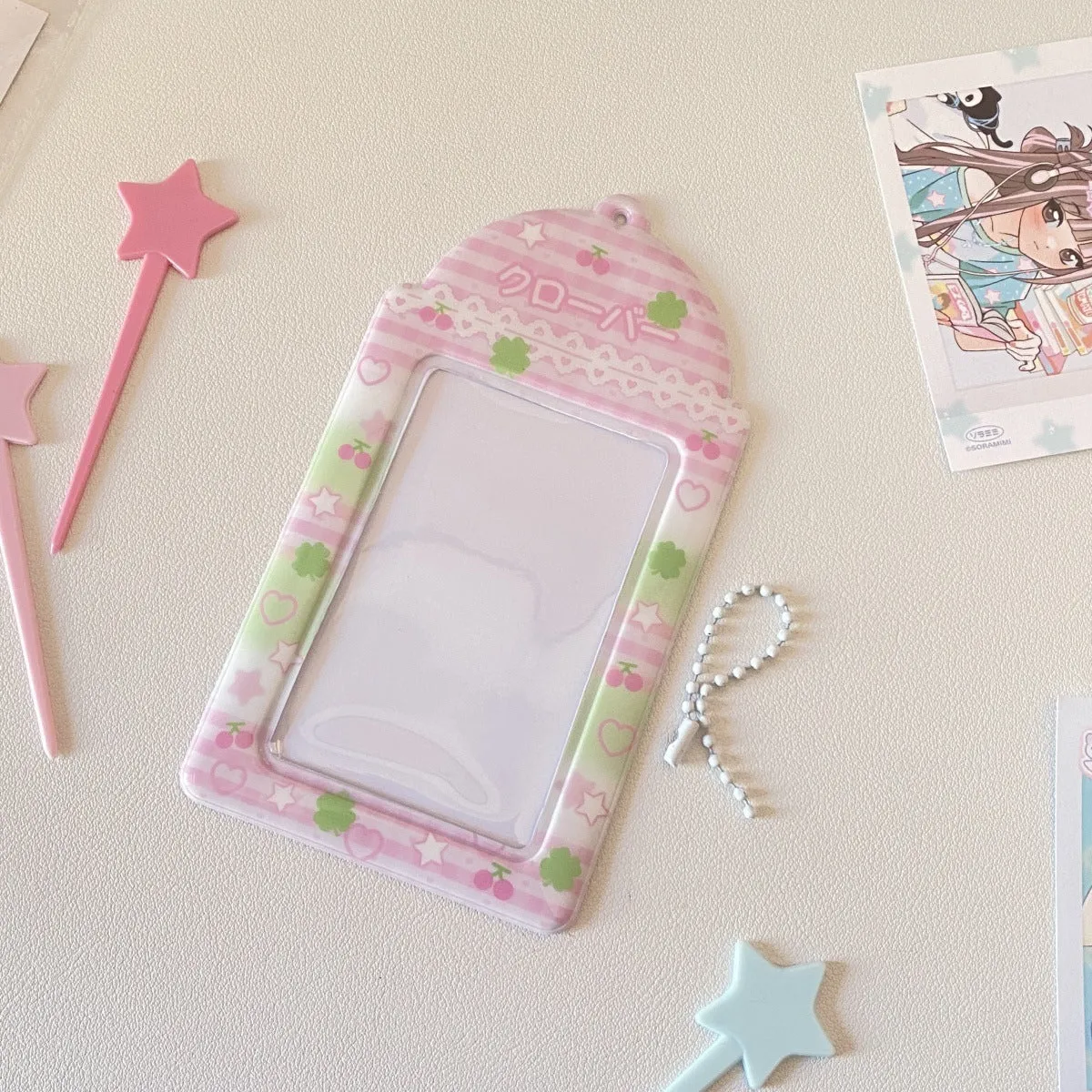 Cartoon strawberry and four-leaf clover PVC meal card holder pendants showing 3-inch card window