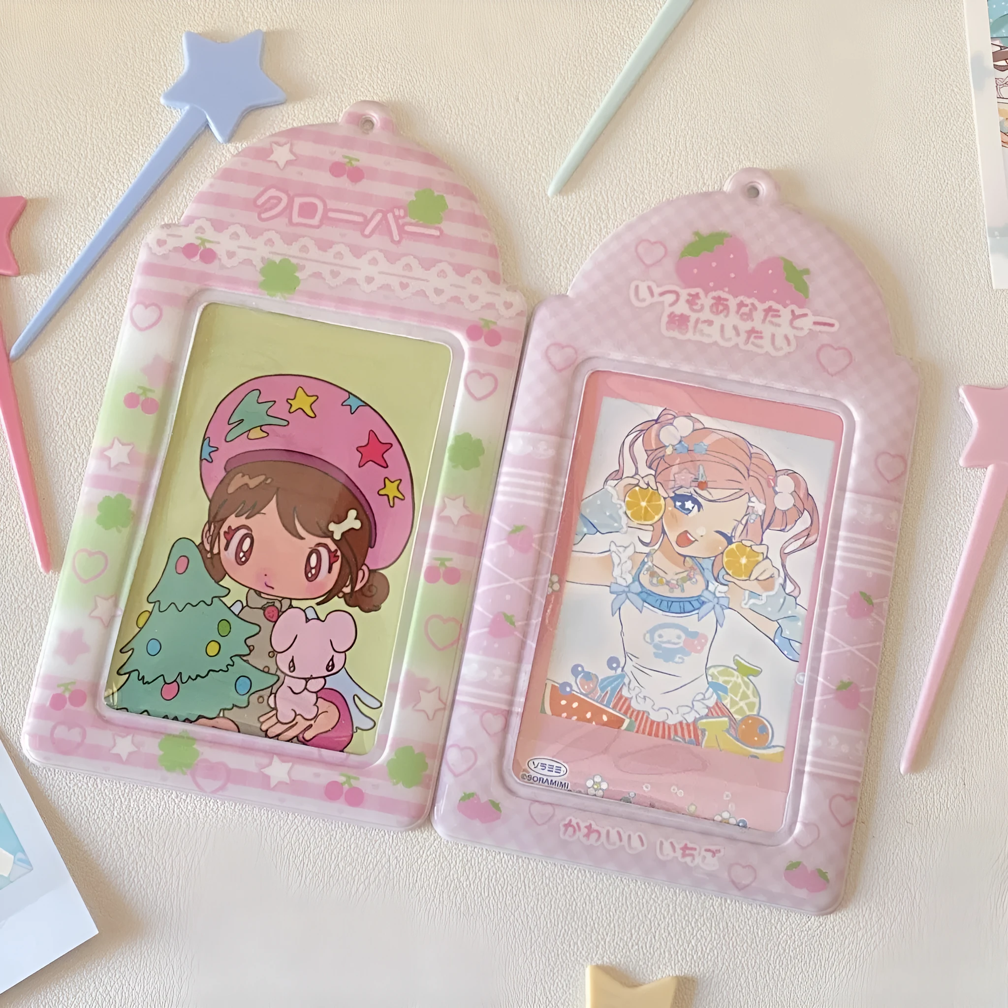 Cartoon strawberry and four-leaf clover PVC meal card holder pendants showing 3-inch card window