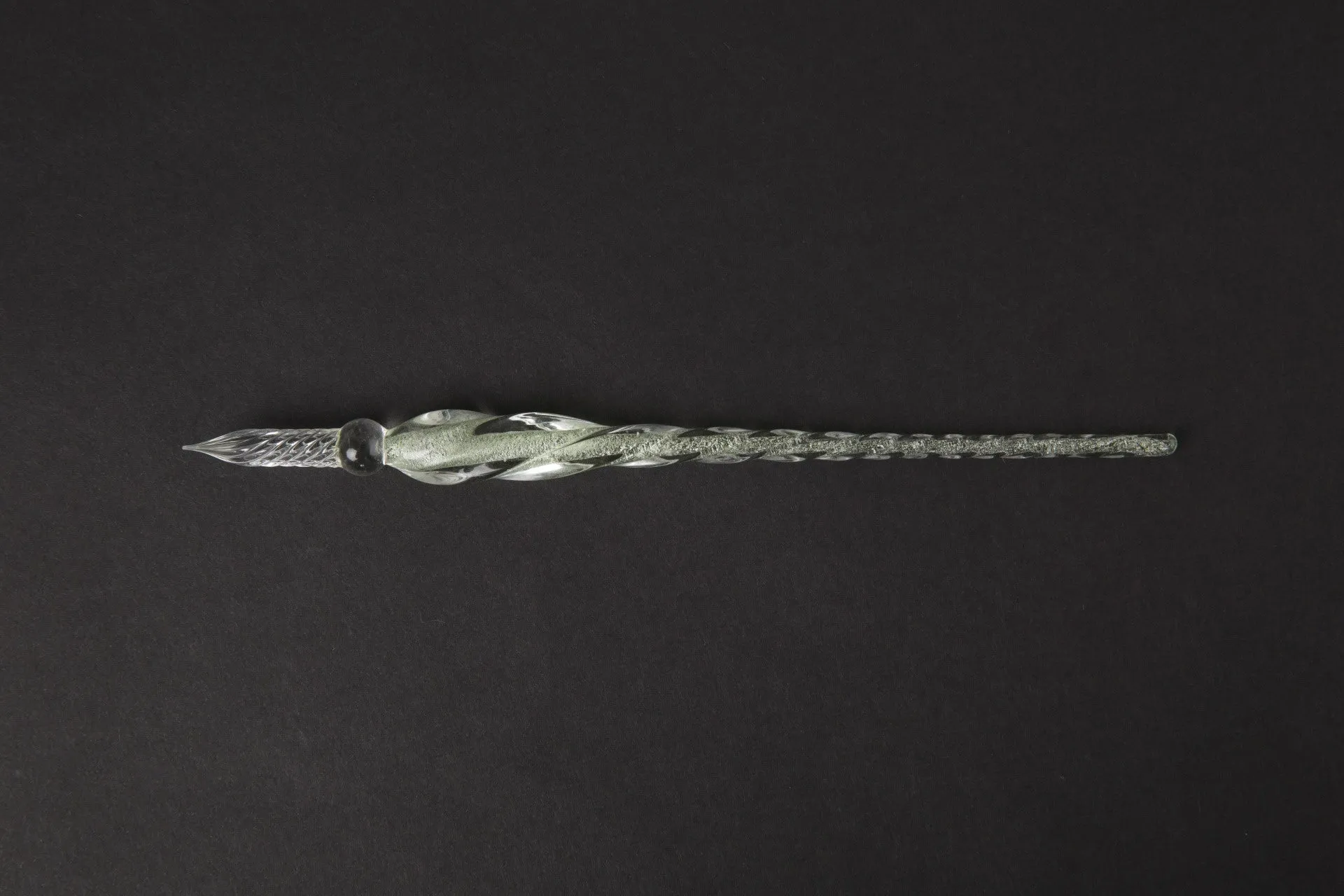 Transparent glass crystal pen with coloured ink visible inside, 0.5mm fine tip, simple modern design
