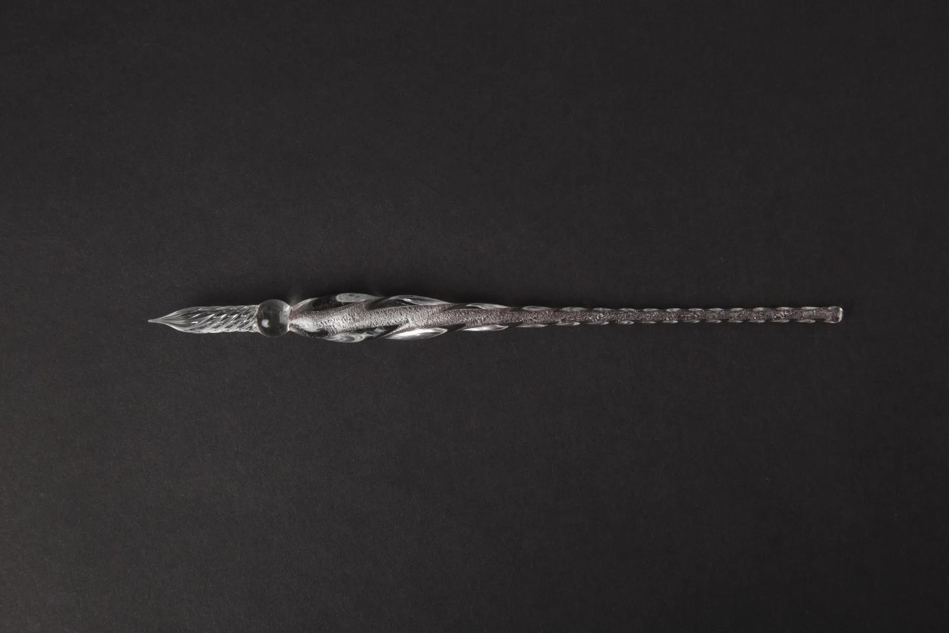 Transparent glass crystal pen with coloured ink visible inside, 0.5mm fine tip, simple modern design