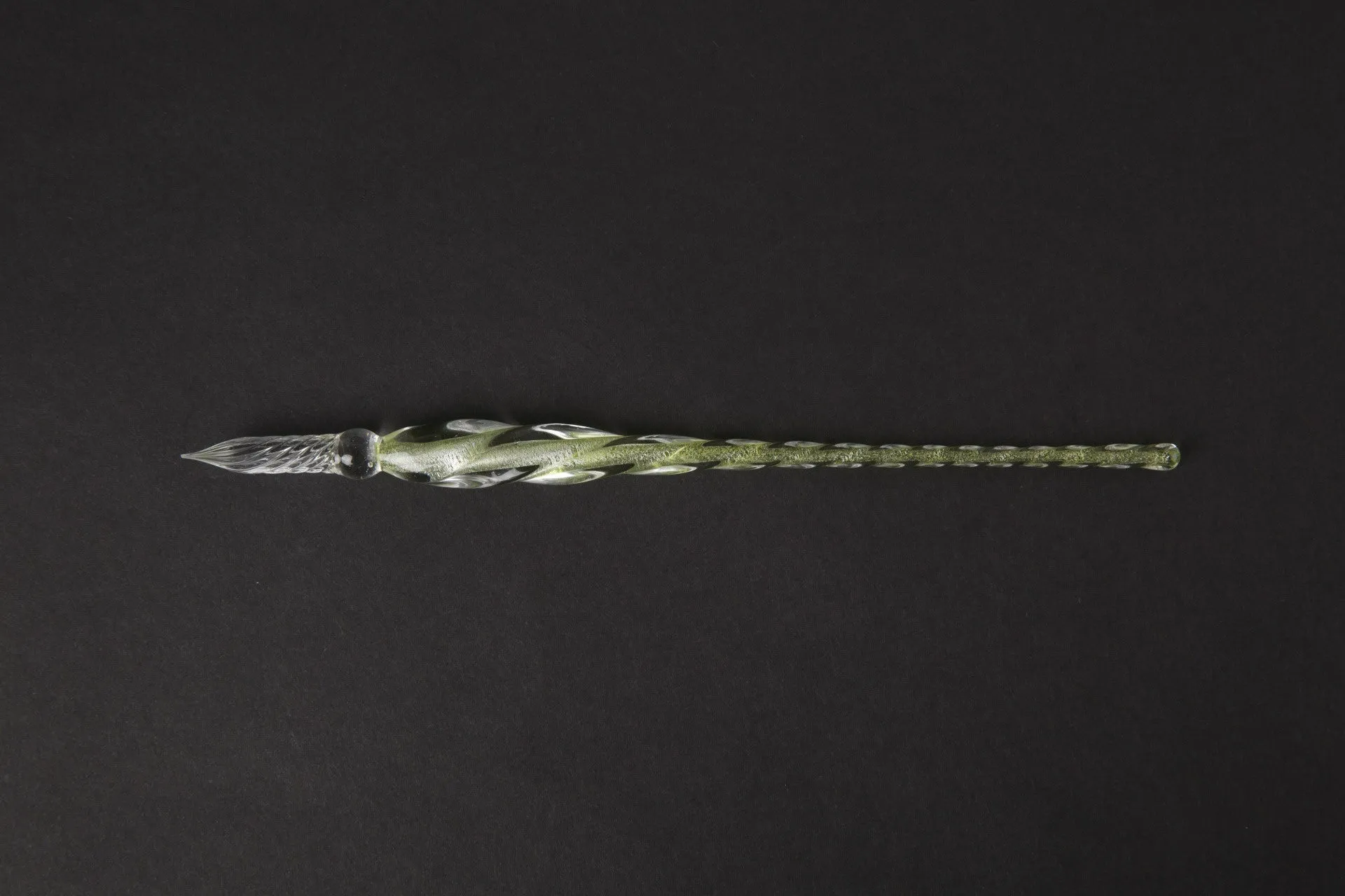 Transparent glass crystal pen with coloured ink visible inside, 0.5mm fine tip, simple modern design