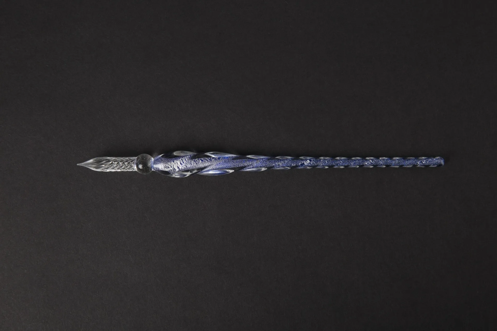 Transparent glass crystal pen with coloured ink visible inside, 0.5mm fine tip, simple modern design