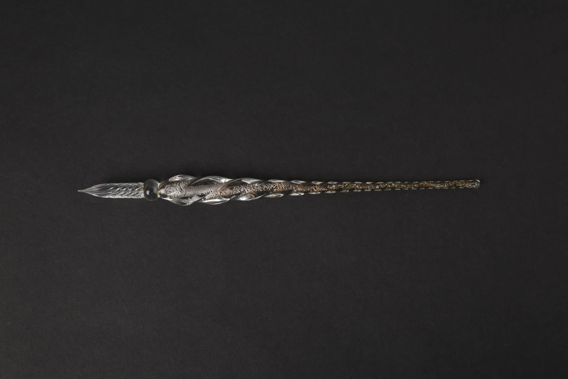 Transparent glass crystal pen with coloured ink visible inside, 0.5mm fine tip, simple modern design