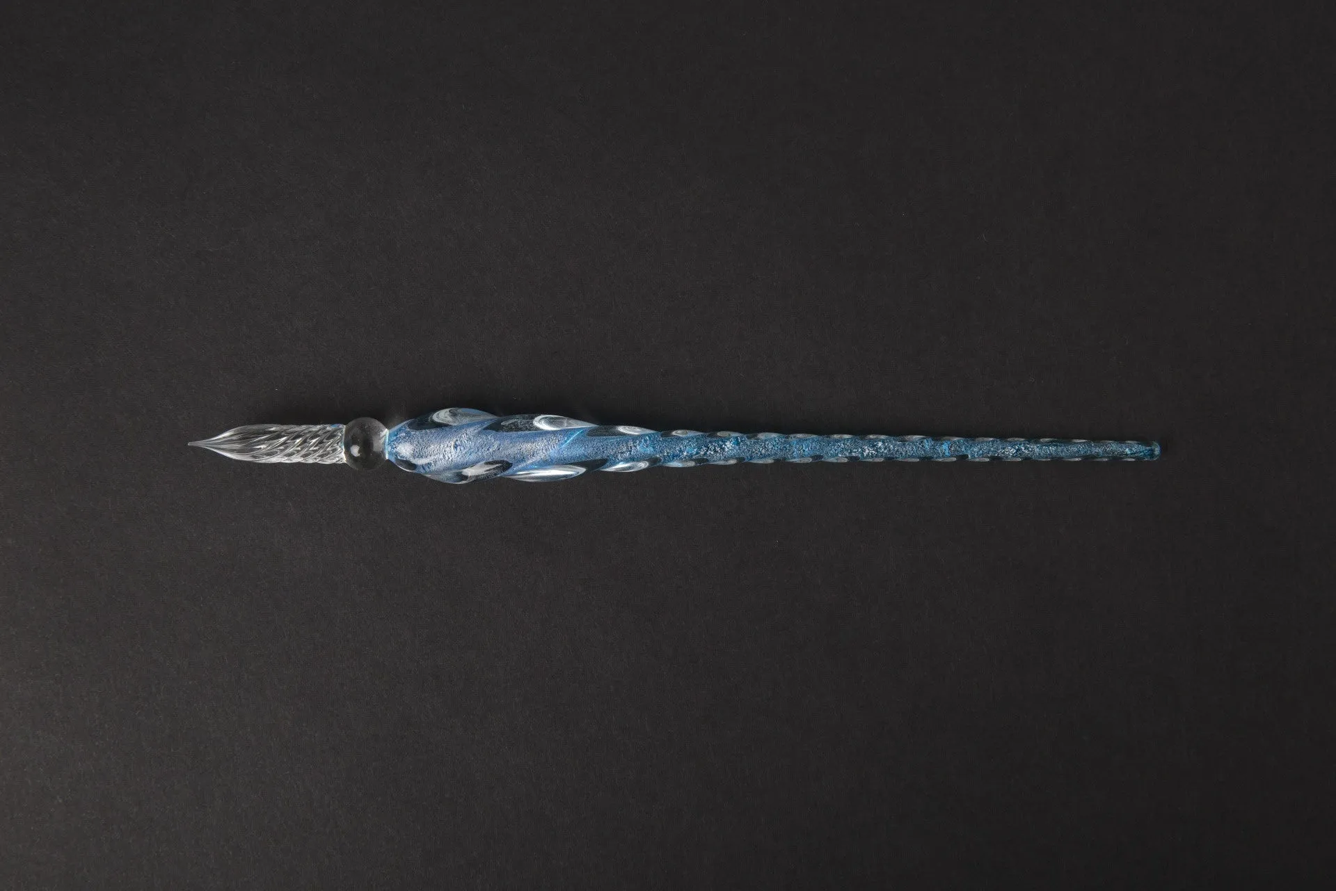 Transparent glass crystal pen with coloured ink visible inside, 0.5mm fine tip, simple modern design