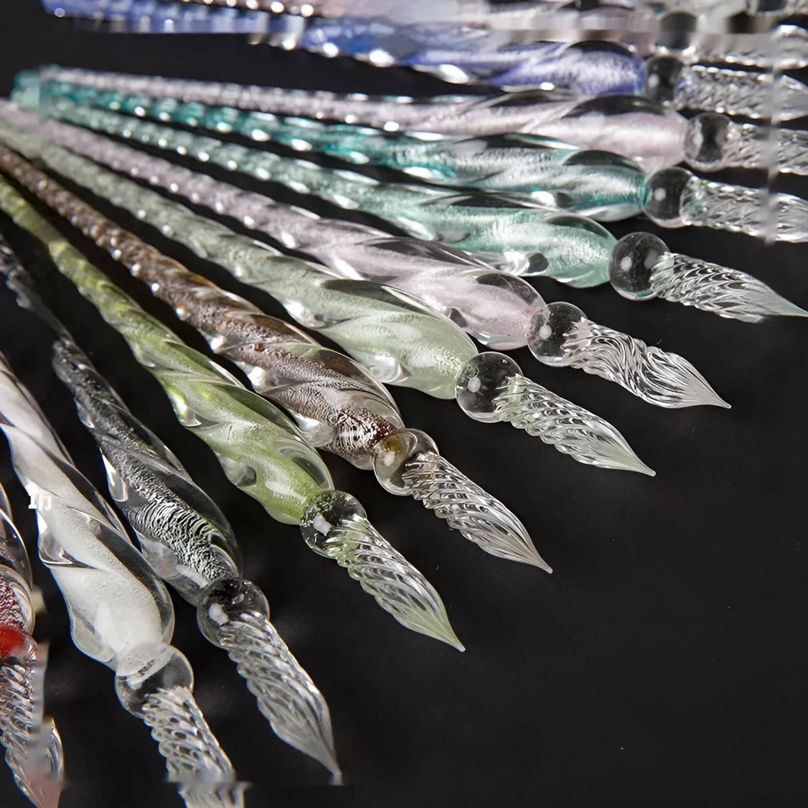 Transparent glass crystal pen with coloured ink visible inside, 0.5mm fine tip, simple modern design