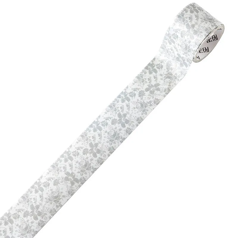 Roll of vintage floral watercolour washi tape on a Japanese paper base, showing patterns like Fog Mountain Forest.