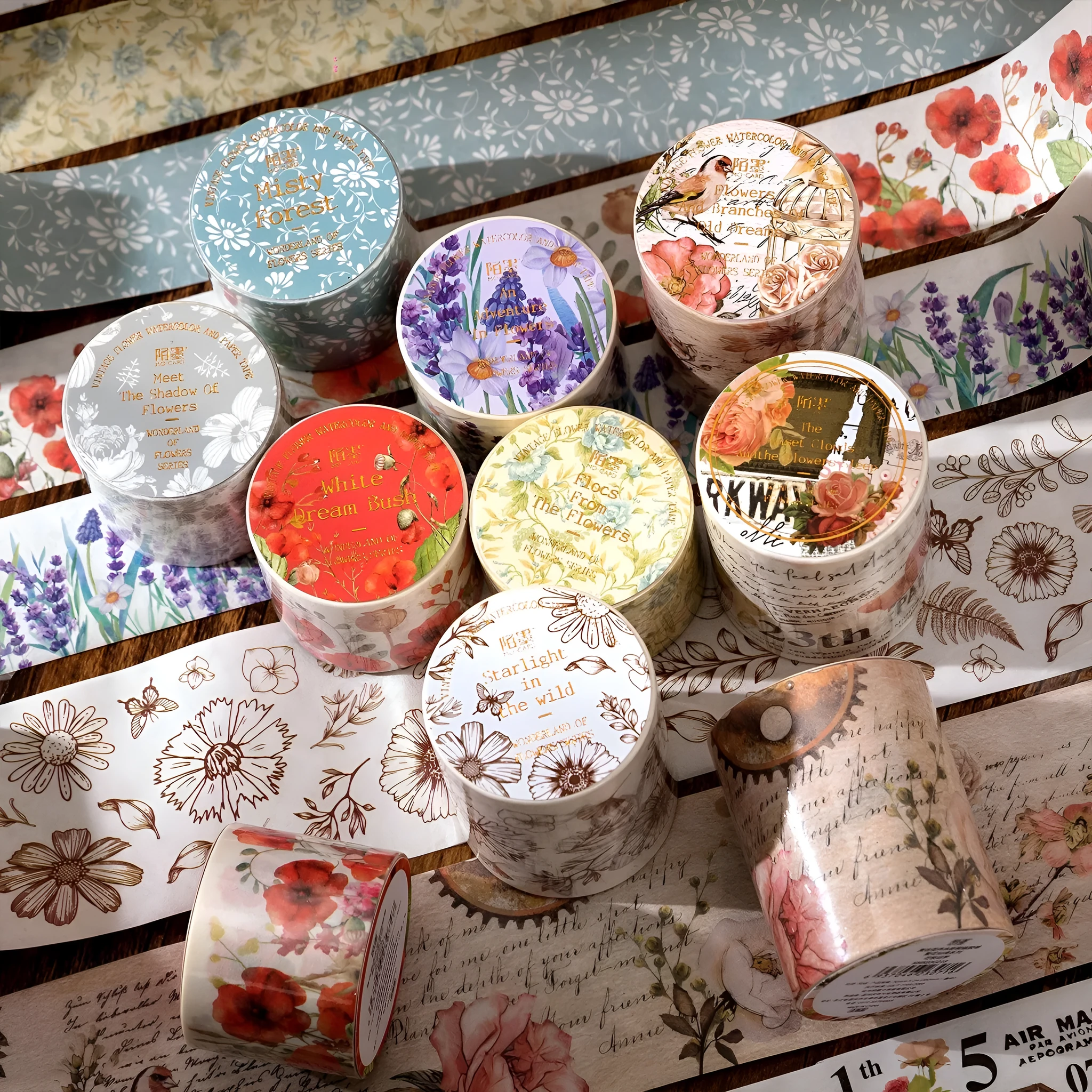 Roll of vintage floral watercolour washi tape on a Japanese paper base, showing patterns like Fog Mountain Forest.