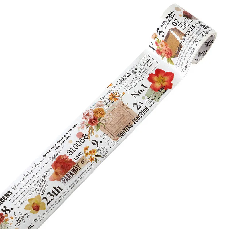 Roll of vintage floral watercolour washi tape on a Japanese paper base, showing patterns like Fog Mountain Forest.