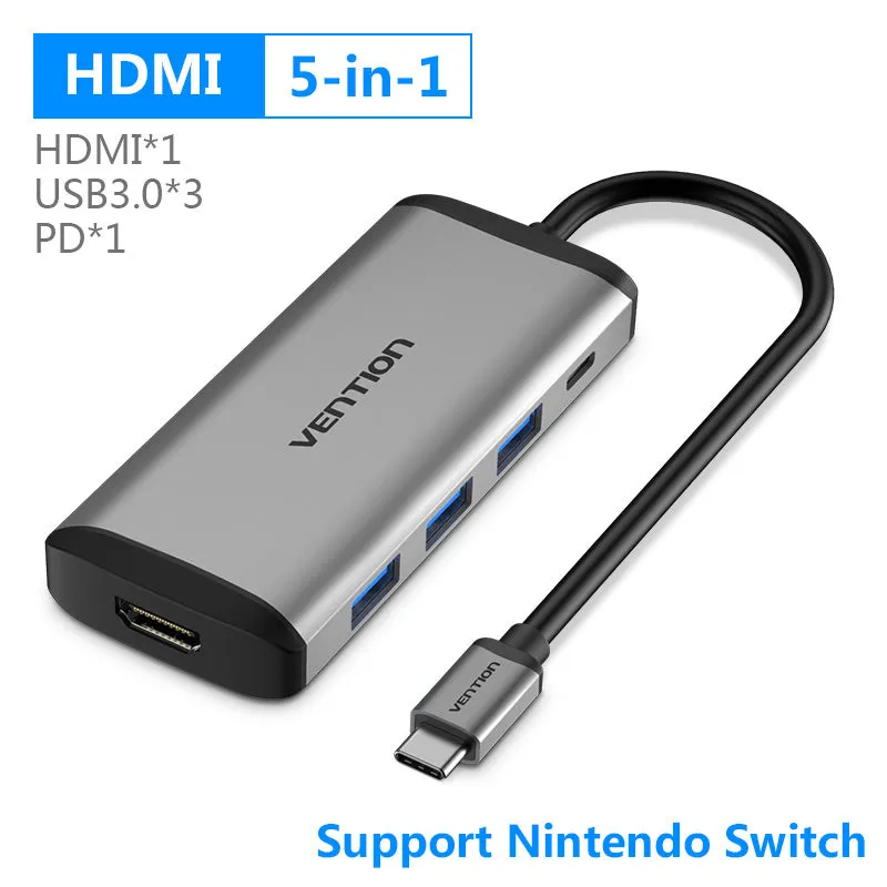 Deep grey Type-C to HDMI USB3.0 Ethernet adapter hub with SD and TF card slots on a desk.