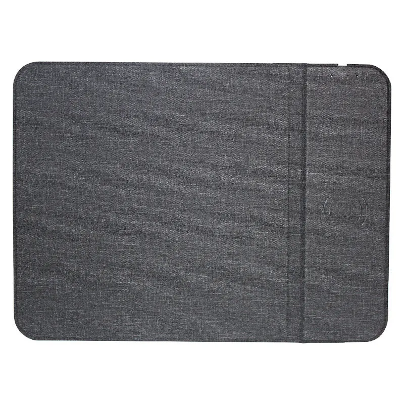 Grey foldable cloth phone holder with wireless charging stand on a desk