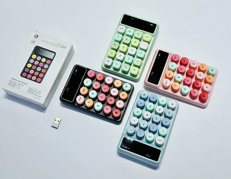 Mini portable wireless keyboard in a macaron colour option on a desk.