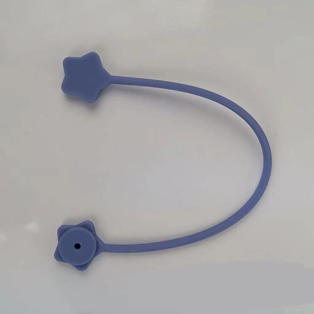 Purple silicone wire winder with magnet for organising headphone and computer cables.