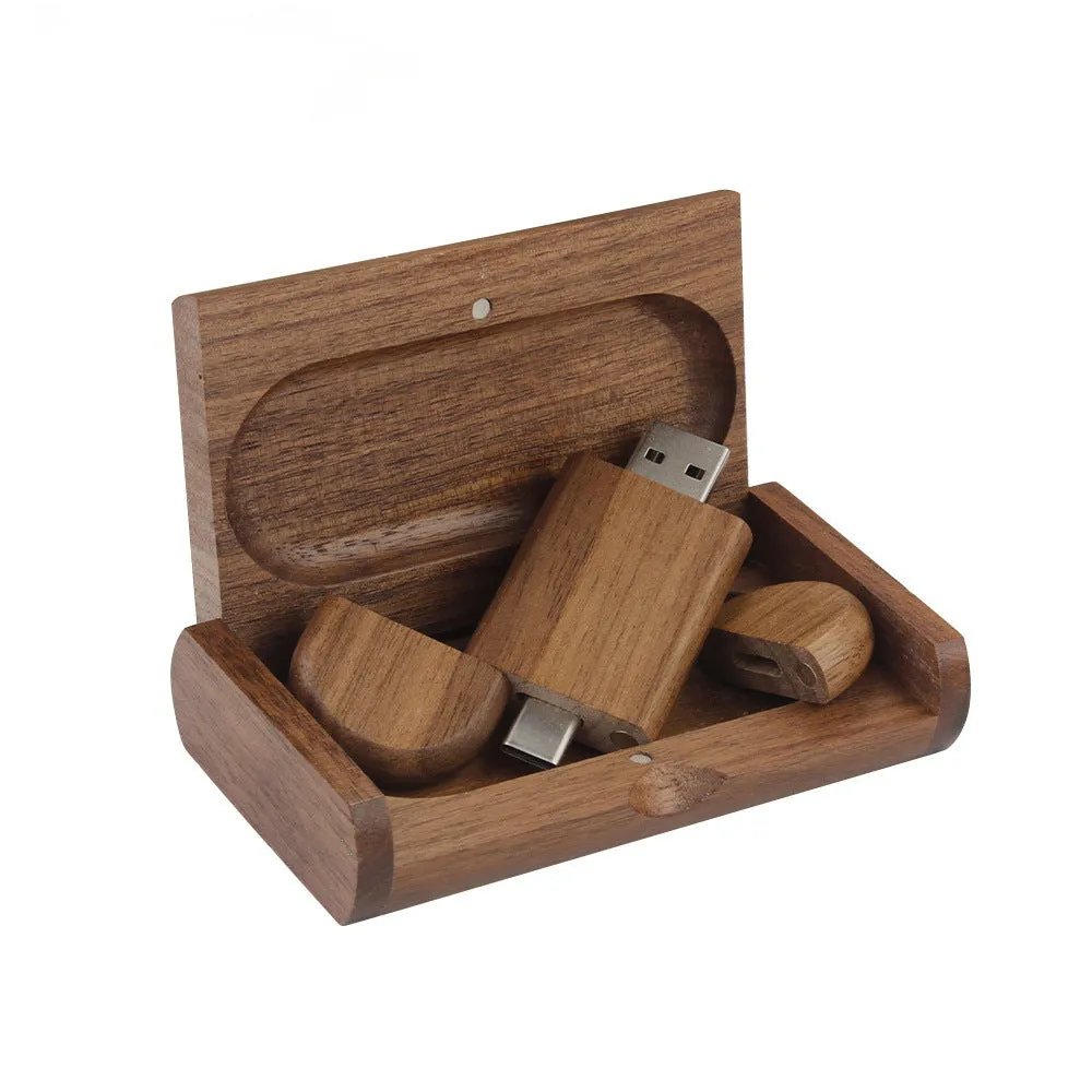 Custom engraved maple wood USB flash drive with Type-C connector for mobile phones on a wooden box.
