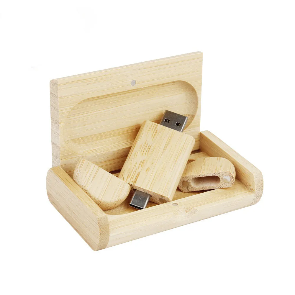 Custom engraved maple wood USB flash drive with Type-C connector for mobile phones on a wooden box.