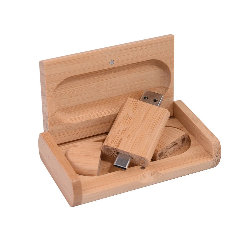 Custom engraved maple wood USB flash drive with Type-C connector for mobile phones on a wooden box.